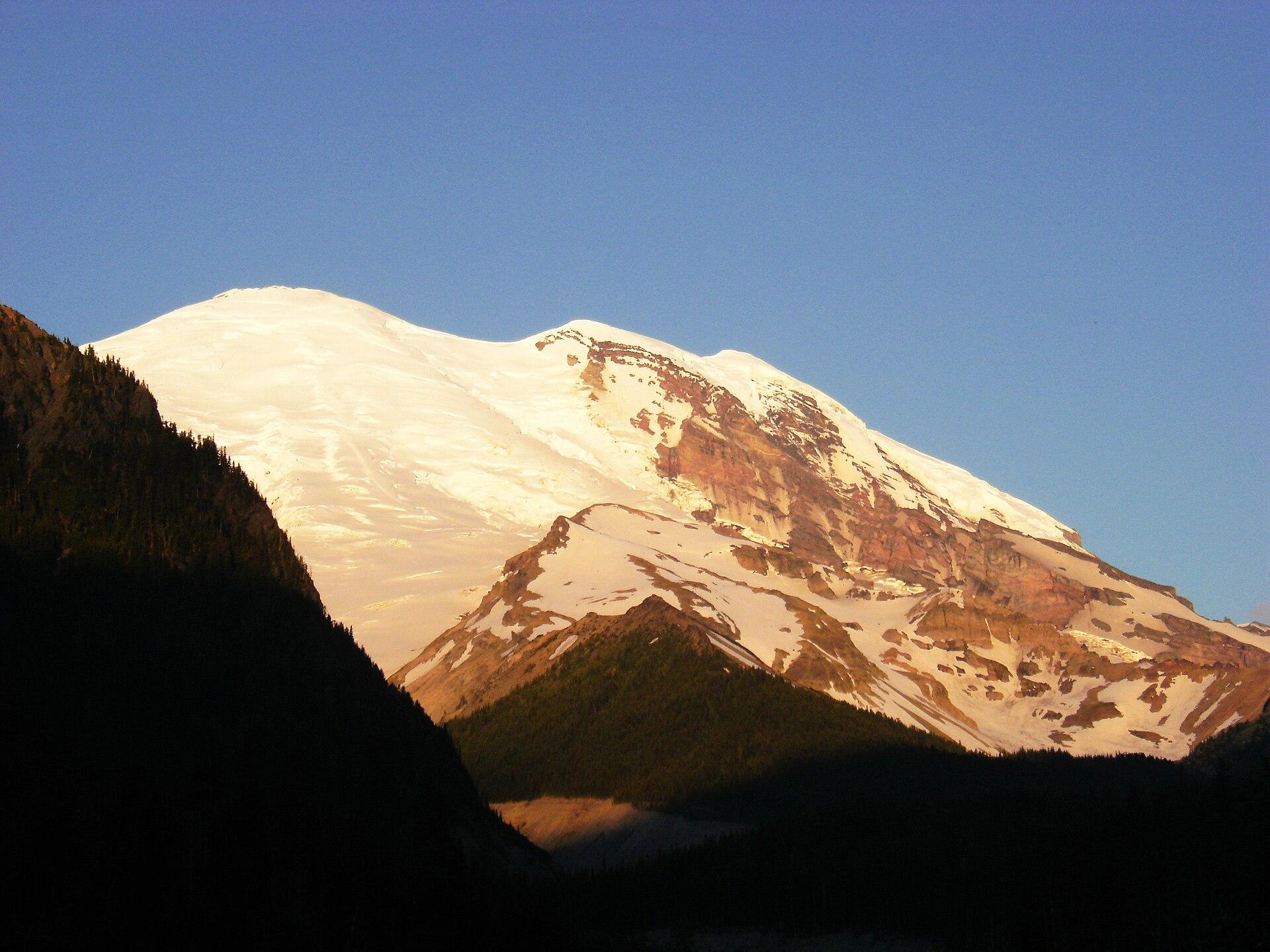 Alpenglow on the summit of Mount Rainier at sunset
